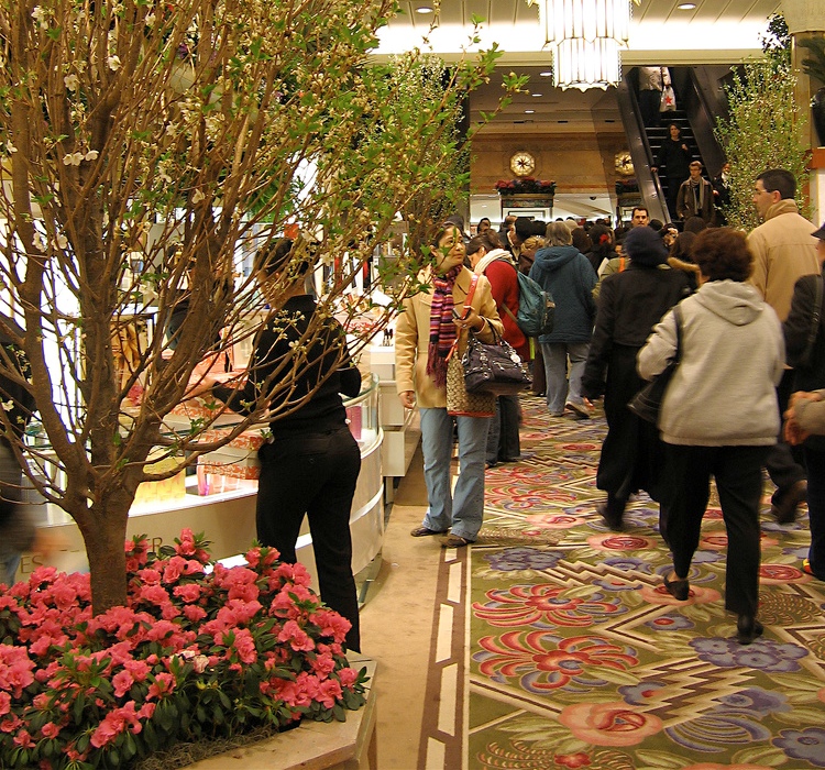 Macy's center aisle transformed into an avenue with blossoming cherry trees.