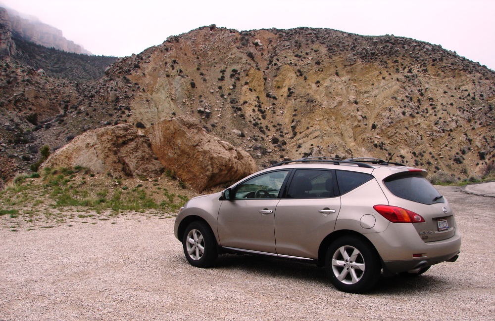 Our SUV and the boulders of Bighorn