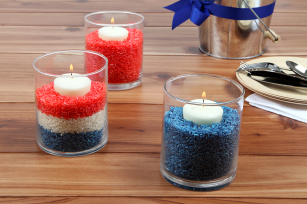 Candles in red, white, and blue rice.