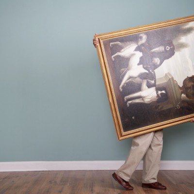 Man moving a painting