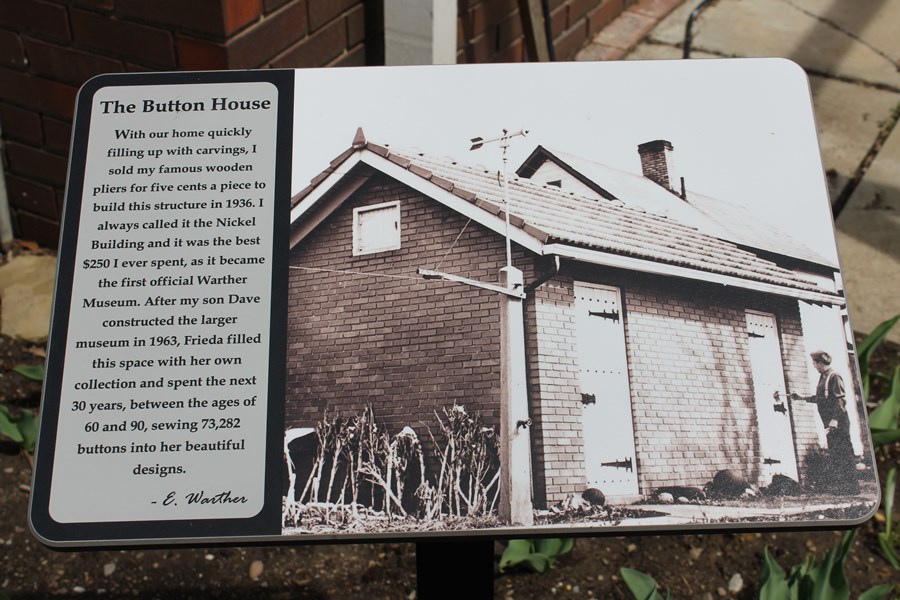 Sign at the Button House tells how, when, and why it was built.