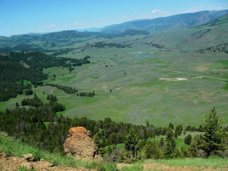 View of the Lamar Valley from Specimen Ridge looking northwest. The ribbon of road just visible at center-right is Highway 212/Northeast Entrance Road.